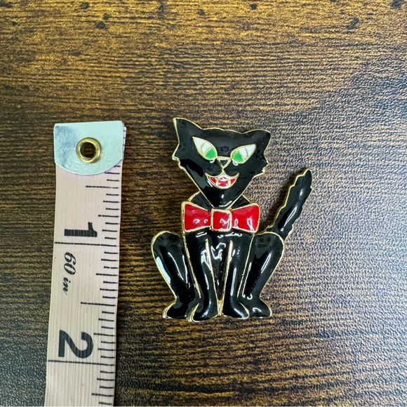 Black Enamel Comical Cat Brooch Pin with Red Bow Tie and Green Eyes - Picture 2 of 5